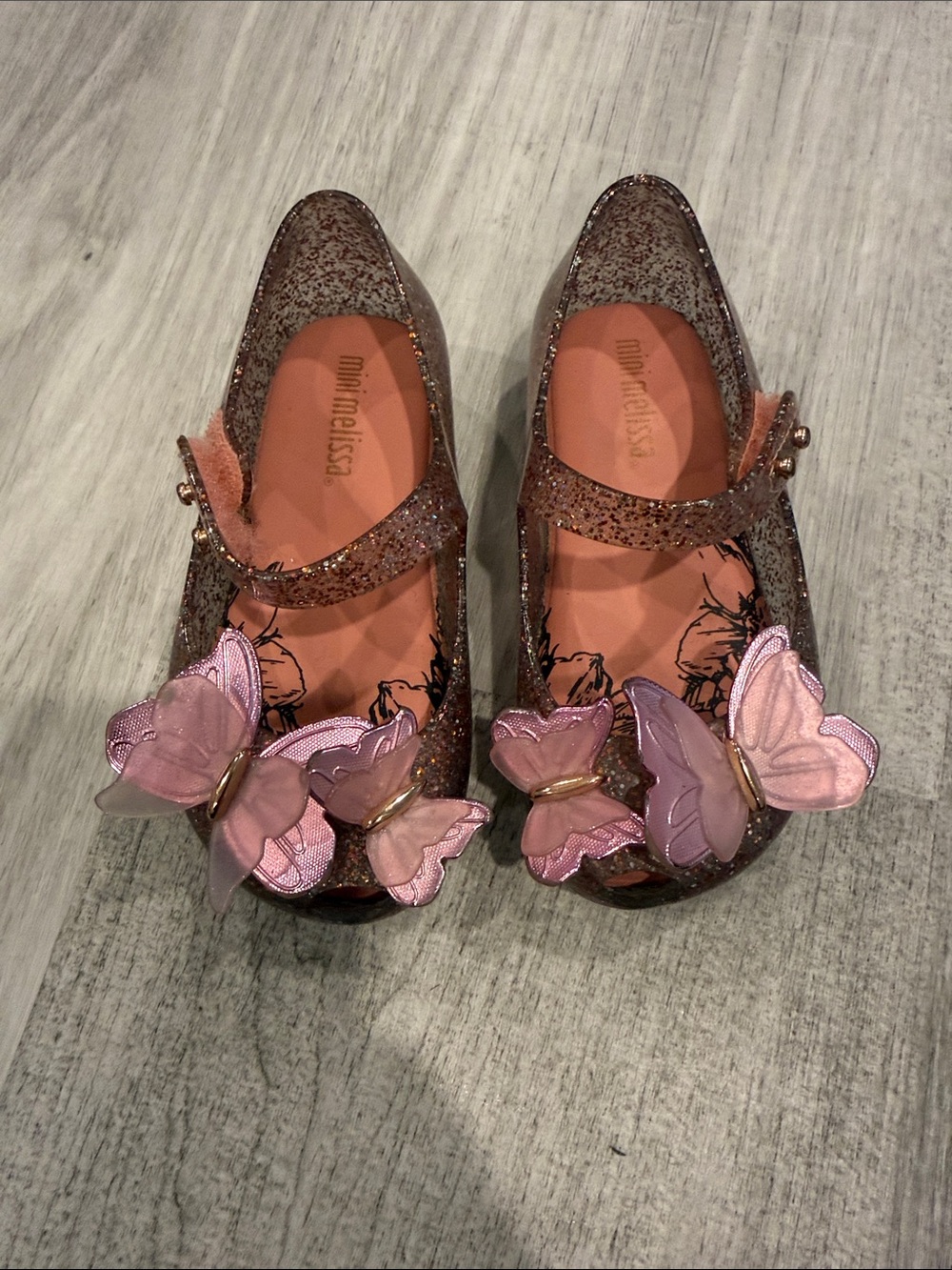 Mini Melissa Glitter Jelly Mary Janes with Pink Butterfly Accents